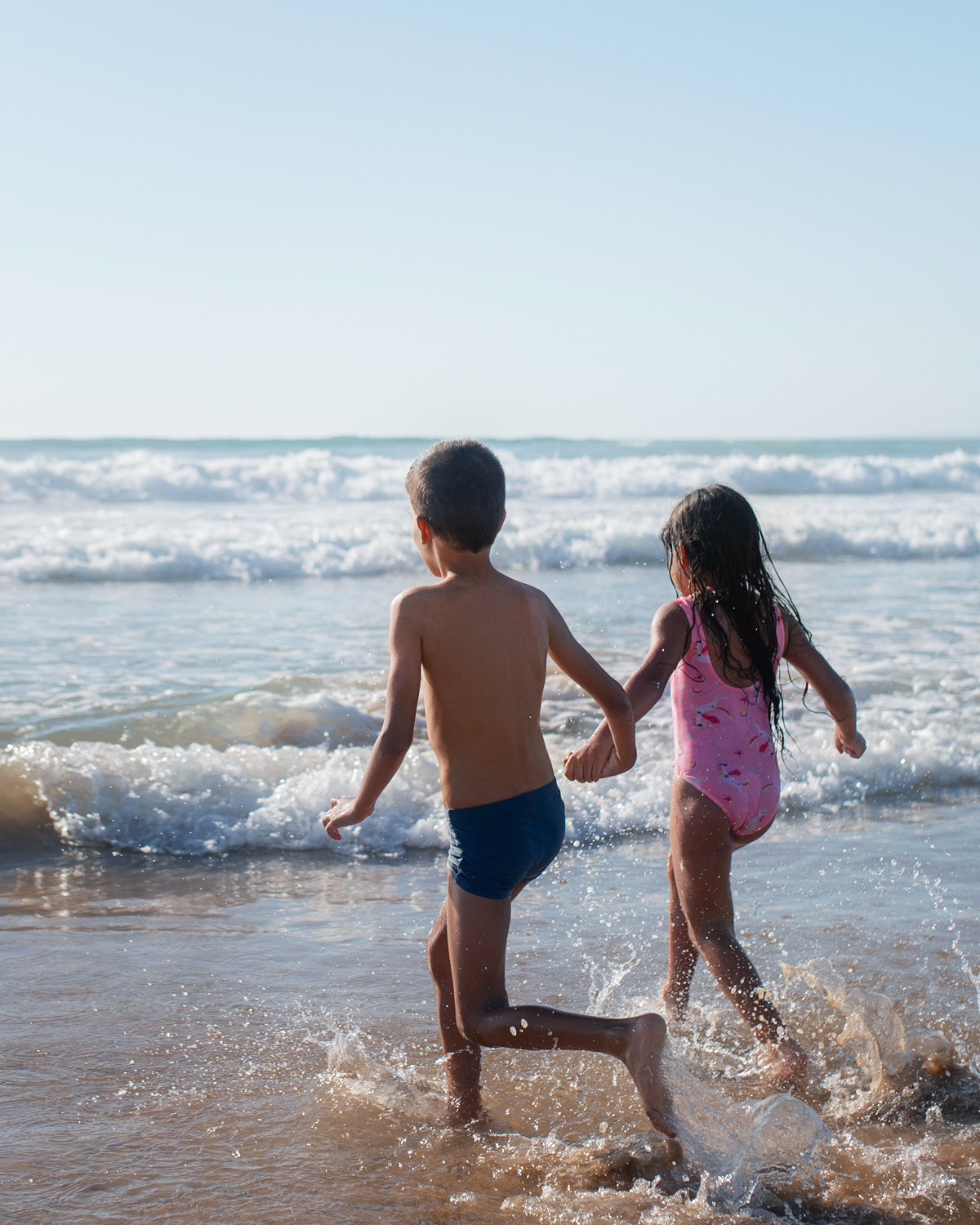 A family moment at the Astric penthouse — kids, beach, summer
